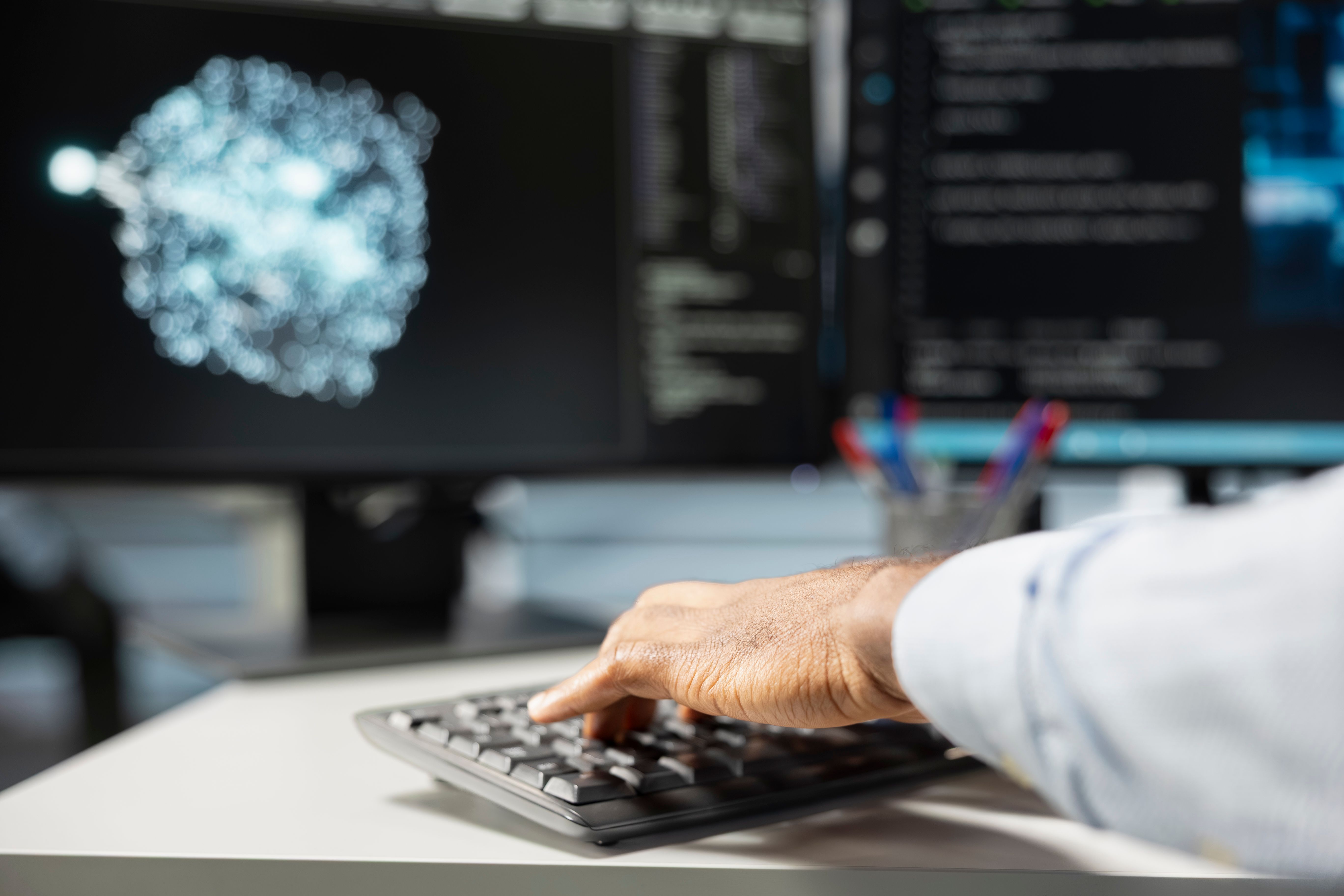 Engineer using visualization tools at a workstation