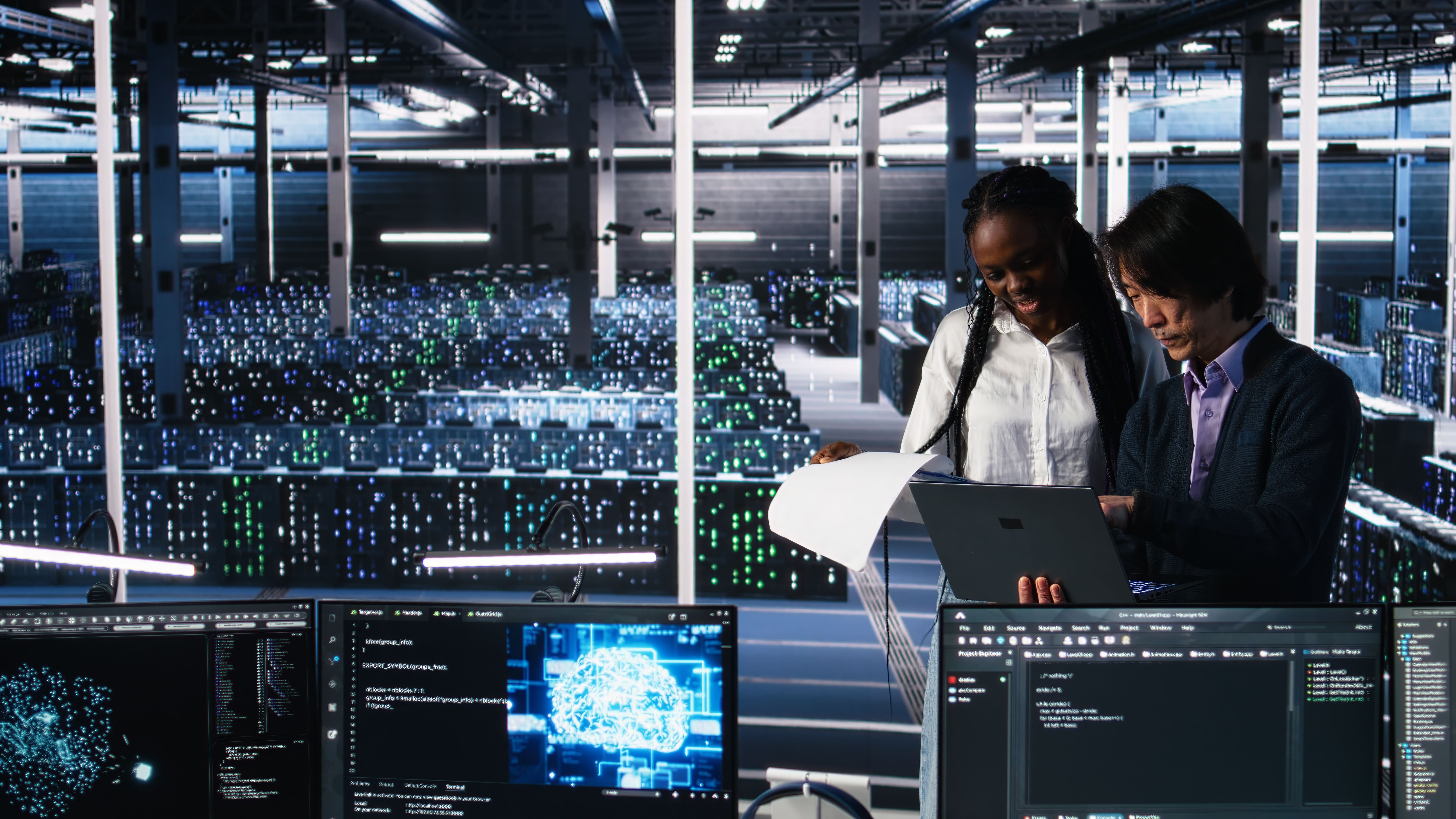 Engineers reviewing automation systems in a data center