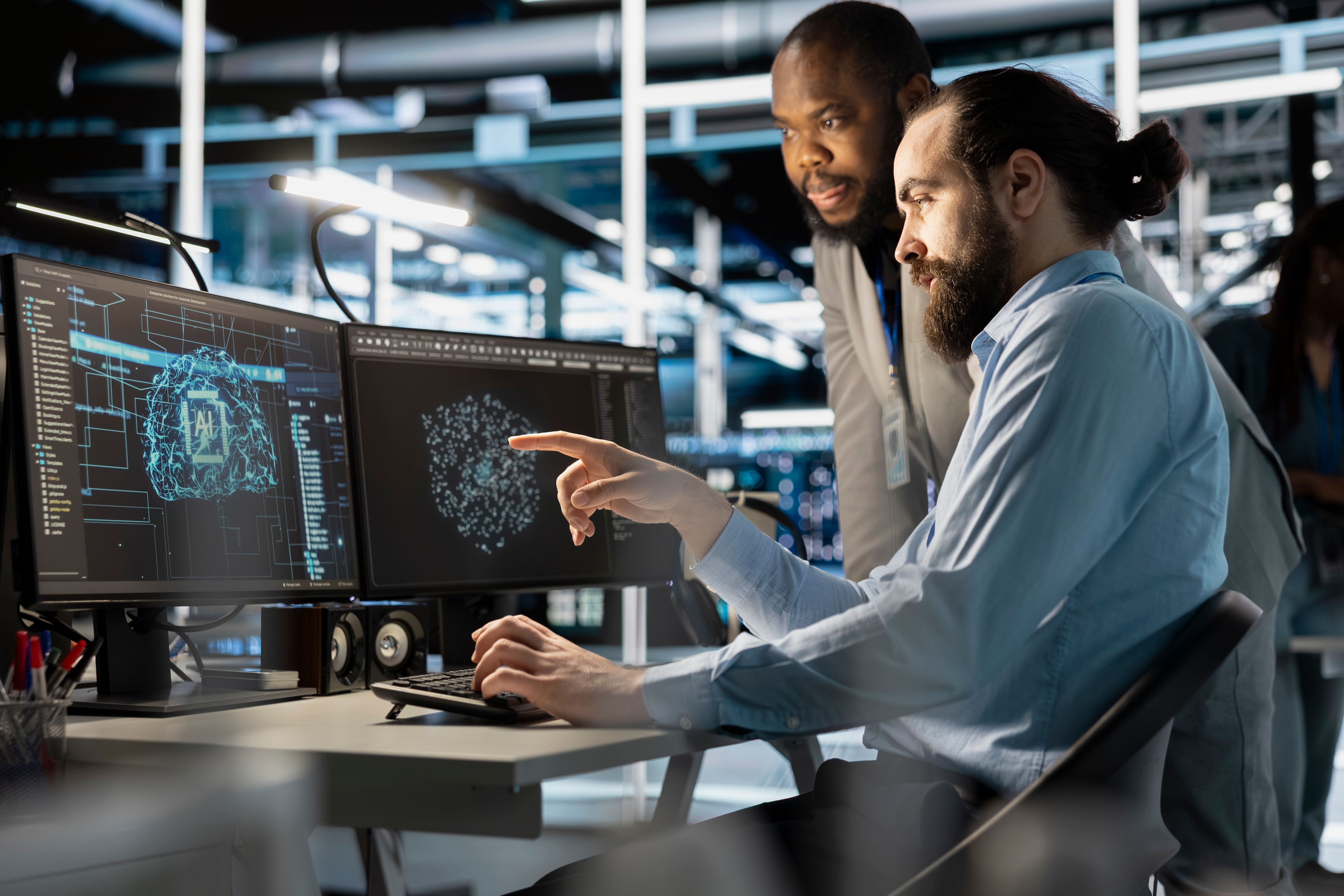 Technicians integrating automation tools at their workstations